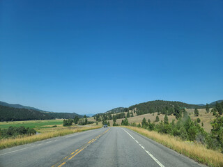 Scenic Open Road Through Golden Landscape