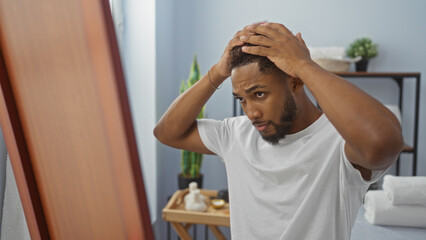Young man checking hair in mirror at modern spa salon with wellness atmosphere and indoor decor