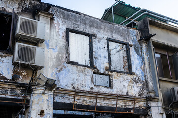 Abandoned, burnt out colonial building - house on Ewe Hai St (Carpenter Street) damaged in fire.