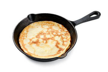 Freshly baked crepe on cooking pan isolated on white background