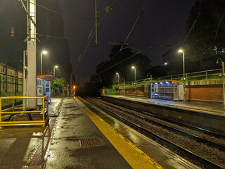 London, UK - 2023.10.26: Two passengers waiting at the platform in West Hampstead station for a...