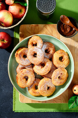 Apple rings fried in batter. Apple donuts - autumn dessert. top view