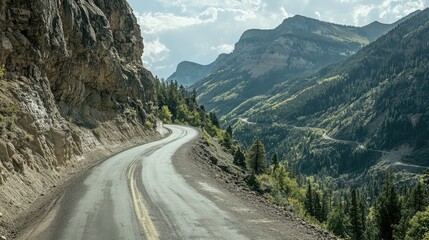 A steep mountain road with sharp turns and rugged cliffs. Road nature travel