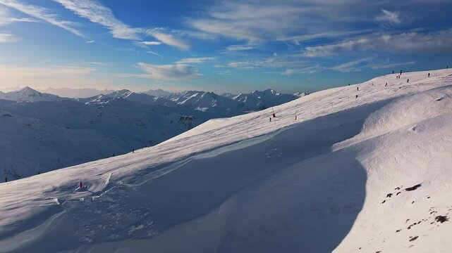 Aerial drone footage from Les Menuires in the french Alps during winter 