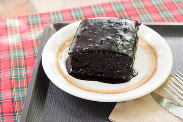 Homemade dark chocolate fudge brownies cake,Traditional French sweet dessert in forest,Delicious Homemade pastries,selective focus.