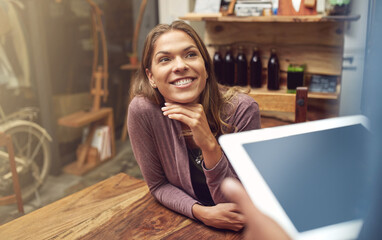 Woman, waiter and customer with tablet, pride and comfort for weekend, relax and peace in cafe. Female person, coffee shop and tech for order in restaurant as happy for breakfast, beverage or morning