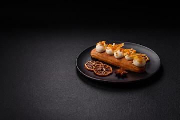 Sweet dessert eclairs or profiteroles with chocolate filling