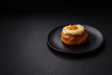 Sweet dessert danish with raisins, cream and pear filling