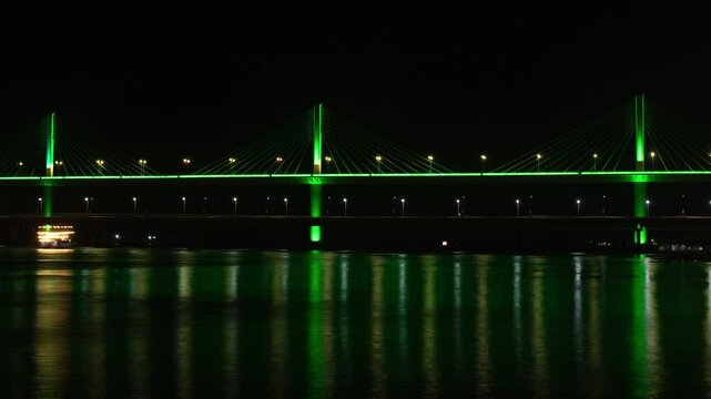 4K night timelapse hyperlapse footage of the lit up Atal Setu Bridge and activities in mandovi river in Panaji, Goa. Places to visit in Goa when on vacation