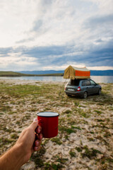 red mug with coffee or tea