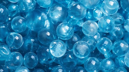 A Beautiful Collection of Shiny Blue Glass Marbles and Beads