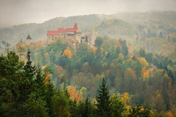 Beautiful old castle Pernstejn in forests with autumn landscape. Beautiful autumn landscape with...