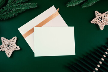 Christmas greeting card with on emerald background, blank card mock up. 