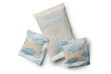 various sizes of desiccant silica gel packets isolated white background, filled with beads form of...