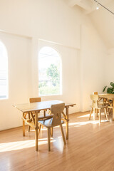 Modern interior of stylish dining room interior with family table and wood chairs,Neutral living room,stylish home decor,Template.