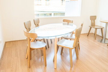 Modern interior of stylish dining room interior with family table and wood chairs,Neutral living room,stylish home decor,Template.