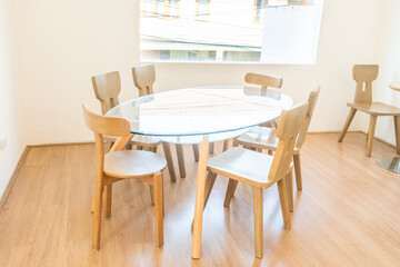 Modern interior of stylish dining room interior with family table and wood chairs,Neutral living room,stylish home decor,Template.