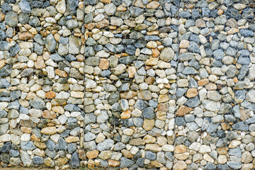 Modern Privacy Fence of Natural Rock Gabions, Walls made of stone and iron Made by welding steel into a sieve and then put the stone in the middle,style of hotel or office Building,Selective focus.