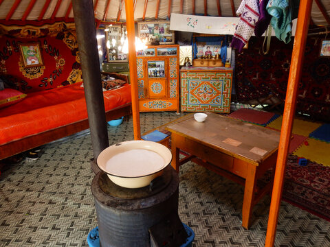 Yaks Milk on a Stove Inside a Ger in Mongolia