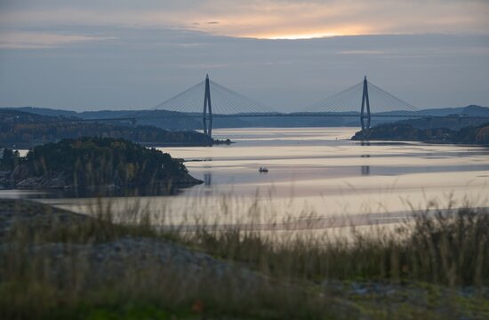 Focus on bridge named "Uddevallabron" Close to the town named "Uddevalla" in Sweden. Diffuse foreground.