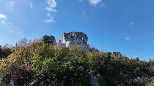 Aerial drone view of Zborow Hill, Poland. Limestone rock formation at peak of Gora Zborow, Podlesice, Poland. Krakow Czestochowa Upland. Polish Jurassic Highland Mountainl Zborow in autumn.