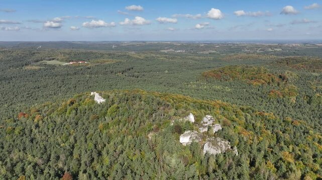 Aerial drone view of Zborow Hill, Poland. Limestone rock formation at peak of Gora Zborow, Podlesice, Poland. Krakow Czestochowa Upland. Polish Jurassic Highland Mountainl Zborow in autumn.