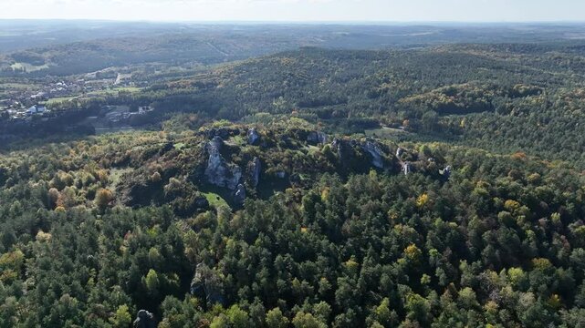 Aerial drone view of Zborow Hill, Poland. Limestone rock formation at peak of Gora Zborow, Podlesice, Poland. Krakow Czestochowa Upland. Polish Jurassic Highland Mountainl Zborow in autumn.