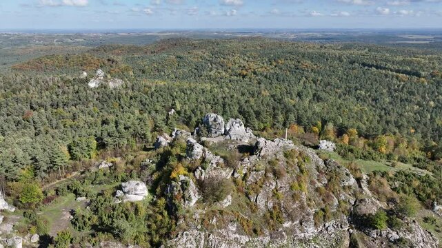 Aerial drone view of Zborow Hill, Poland. Limestone rock formation at peak of Gora Zborow, Podlesice, Poland. Krakow Czestochowa Upland. Polish Jurassic Highland Mountainl Zborow in autumn.