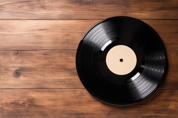 A classic black vinyl record on a wooden surface, showcasing its timeless appeal and connection to music history.