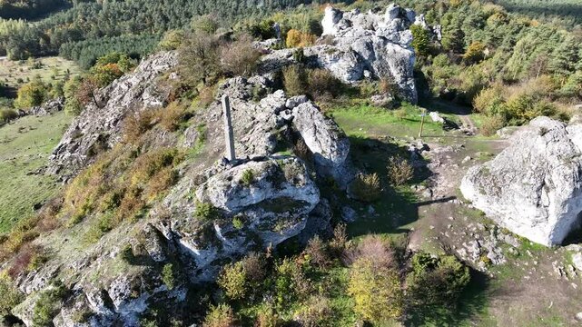 Aerial drone view of Zborow Hill, Poland. Limestone rock formation at peak of Gora Zborow, Podlesice, Poland. Krakow Czestochowa Upland. Polish Jurassic Highland Mountainl Zborow in autumn.