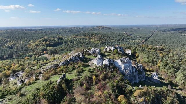 Aerial drone view of Zborow Hill, Poland. Limestone rock formation at peak of Gora Zborow, Podlesice, Poland. Krakow Czestochowa Upland. Polish Jurassic Highland Mountainl Zborow in autumn.