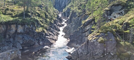 fresh mountain water stream running through a steep v shaped valley in norway © Arcticphotoworks