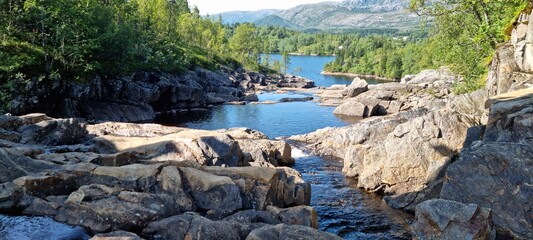 low water level in dammed river stream from mountain