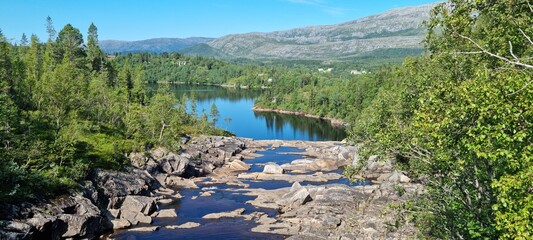 low water level in dammed river stream from mountain