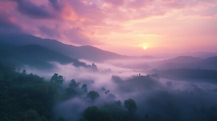 Misty Mountain Sunrise: Serene landscape photography captures a breathtaking sunrise over misty mountains, painting the sky in vibrant hues of pink and purple.  A tranquil scene perfect for travel.