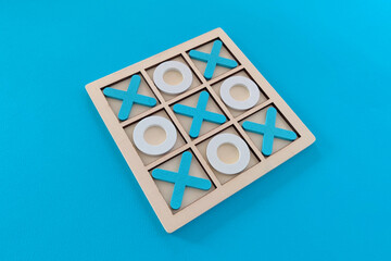 Tic tac toe game set on blue background