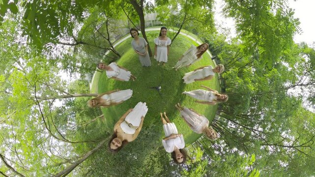 Immerse yourself in a magical midsummer nights dream as 11 women in ethereal white dresses dance gracefully in a circle, their movements perfectly synchronized. The enchanting choreography, set