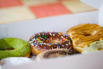 Assorted doughnuts in a box.
