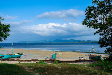 Boats by the shore of Punta Verde in Palaui Island Philippines.