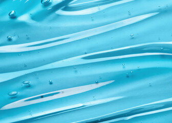 Liquid gel beauty serum texture. Beauty skincare liquid blue gel background with bubbles. Skincare...