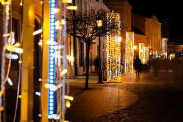 Fototapeta premium Festive Christmas lights at night on a city street in Hungary