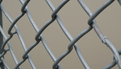 Fototapeta premium Industrial park Metal chain-link fence for security