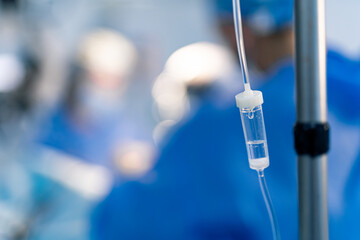 Medical team in operating room. A medical team works diligently in an operating room while an...