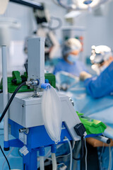 Surgeons in a complex hospital procedure. A team of surgeons operates in a modern hospital setting,...