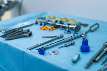 Surgical instruments arranged on a sterile table. A variety of surgical tools are meticulously...