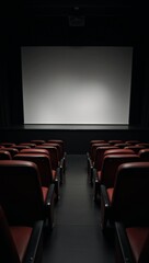 Fototapeta premium A staged venue featuring rows of empty seats and a large blank screen