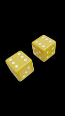yellow dices on black background