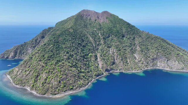 The scenic island of Komba lies about 70 km north of the island of Lembata in the Lesser Sunda Islands of Indonesia. This remote island, surrounded by reef, is an active volcano that often erupts.