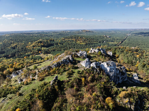 Aerial drone view of Zborow Hill, Poland. Limestone rock formation at peak of Gora Zborow, Podlesice, Poland. Krakow-Czestochowa Upland. Polish Jurassic Highland Mountainl Zborow in autumn.
