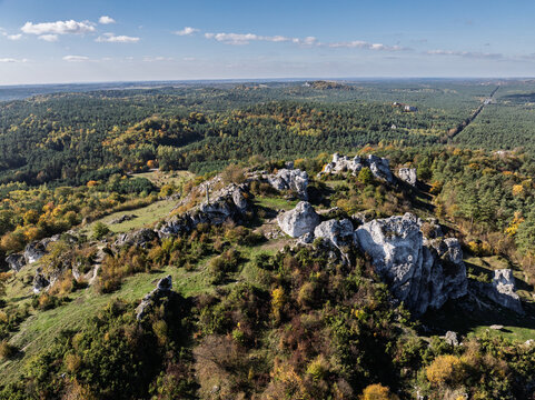 Aerial drone view of Zborow Hill, Poland. Limestone rock formation at peak of Gora Zborow, Podlesice, Poland. Krakow-Czestochowa Upland. Polish Jurassic Highland Mountainl Zborow in autumn.